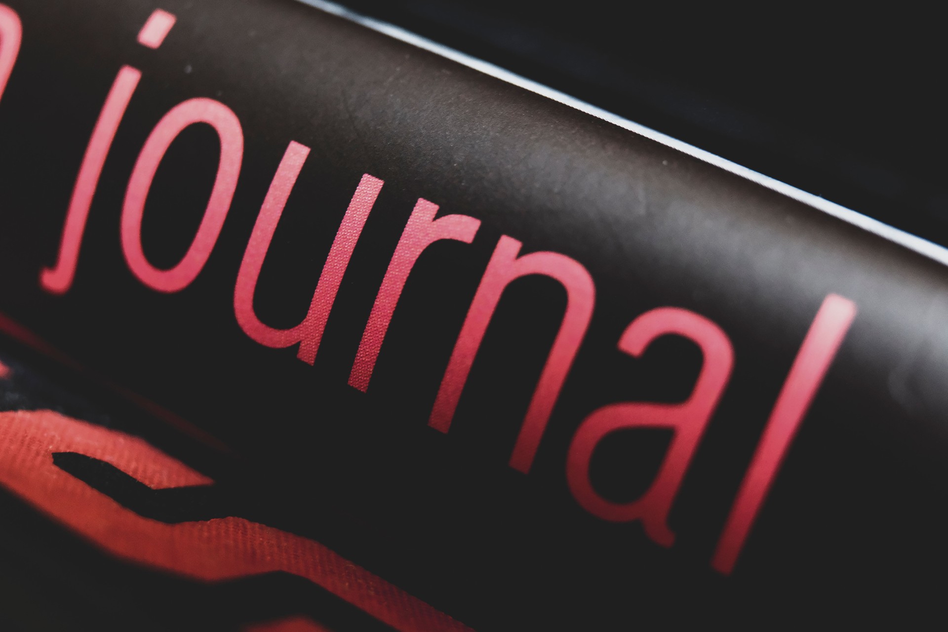 Journal Single Word Only Close-up Red Text Black Background